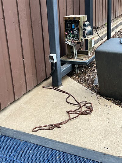 chain from gate laying on the ground