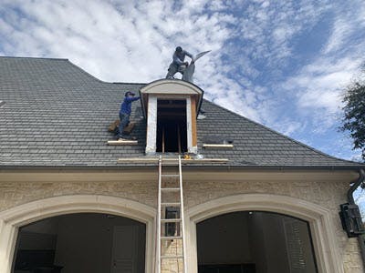 roofers taking off dormers