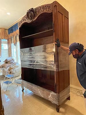 man moving furniture