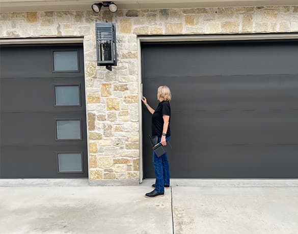 inspector checking the garage door wireless keypad