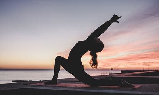 girl doing yoga to relax